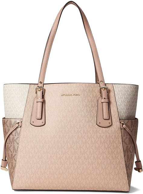 michael michael kors east west travel large leather tote bag|voyager east west tote.